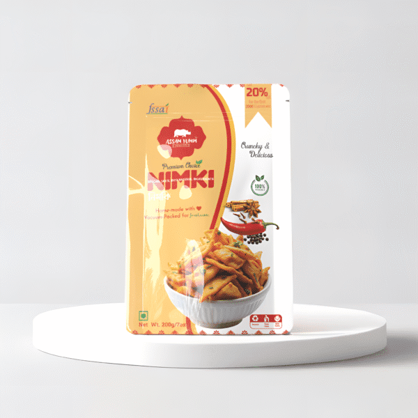 A pouch of assamese nimki in a white minimilastic background ; nimki ; assamese snack , Nimki