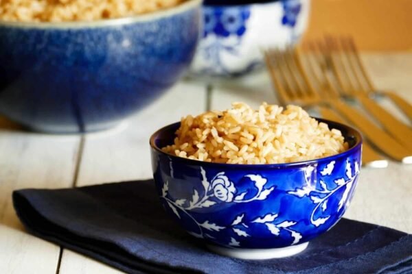 Usna Rice in a spoon in white background : Parboiled rice