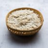 Raw Flattened Rice or Thick or thin Rice Flakes for Namkeen Chivda snacks or Aloo Poha for Indian Breakfast, served in a bowl