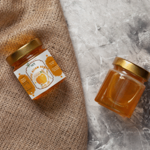 Assamese Raw Honey by assamyumm in a glass jar in a light background